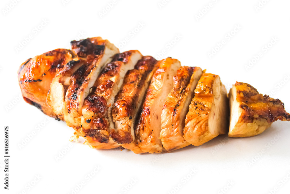 sliced grilled chicken breast on a white background sliced grilled chicken breast on a white background