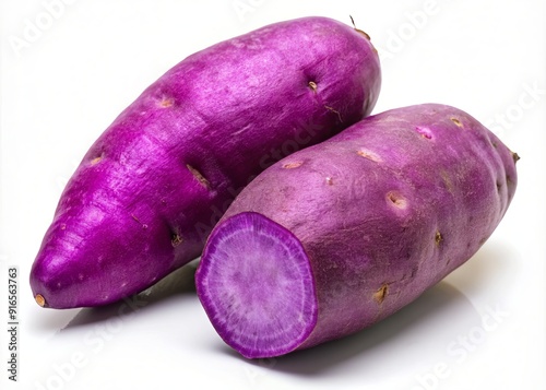 Two vibrant whole purple yams, also known as ube or purple sweet potatoes, isolated against a clean white background.