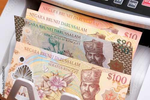 Brunei dollar in the counting machine photo