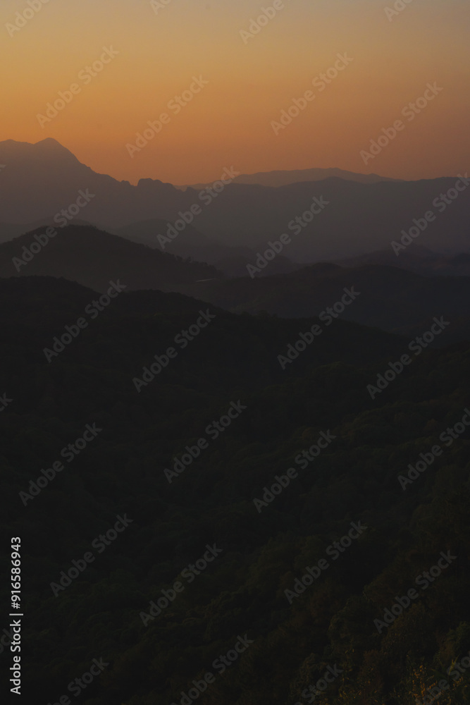 nature traveling with orange sky and layer of mountain with sunrise background nature traveling with orange sky and layer of mountain with sunrise background
