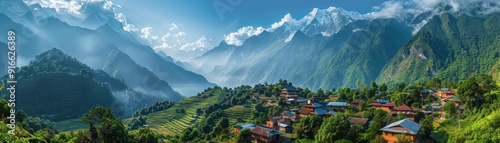 A mountain range with a small village in the valley
