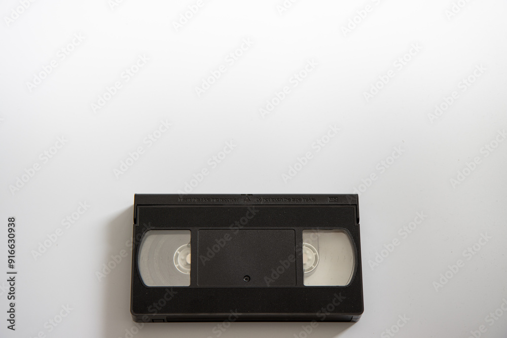 An old retro VHS video tape on a white background An old retro VHS video tape on a white background