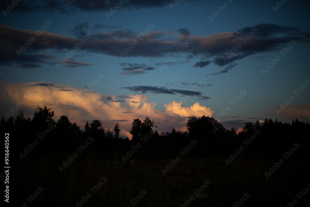 Evening sky. Clouds over the black forest. It's getting dark outside. Evening sky. Clouds over the black forest. It's getting dark outside.