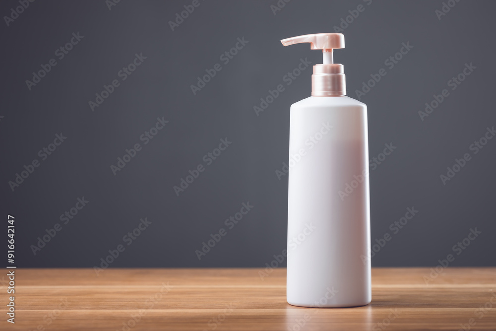 White shampoo bottle on a wooden table with a dark gray background, perfect for advertising minimalist beauty products White shampoo bottle on a wooden table with a dark gray background, perfect for advertising minimalist beauty products