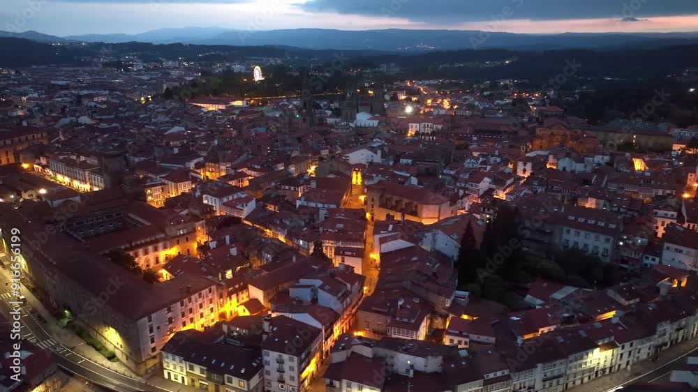 Santiago de Compostela night view with city illumination, aerial view of Spanish city of Santiago de Compostela in the evening, Camino de Santiago Santiago de Compostela night view with city illumination, aerial view of Spanish city of Santiago de Compostela in the evening, Camino de Santiago