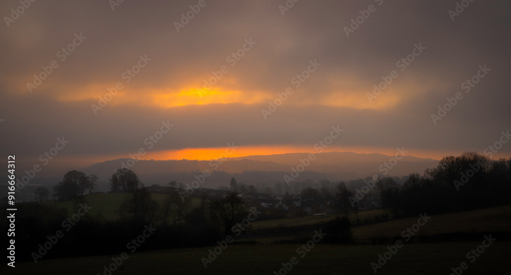 Misty morning sunrise over Gwernaffield, Mold, Wales Misty morning sunrise over Gwernaffield, Mold, Wales
