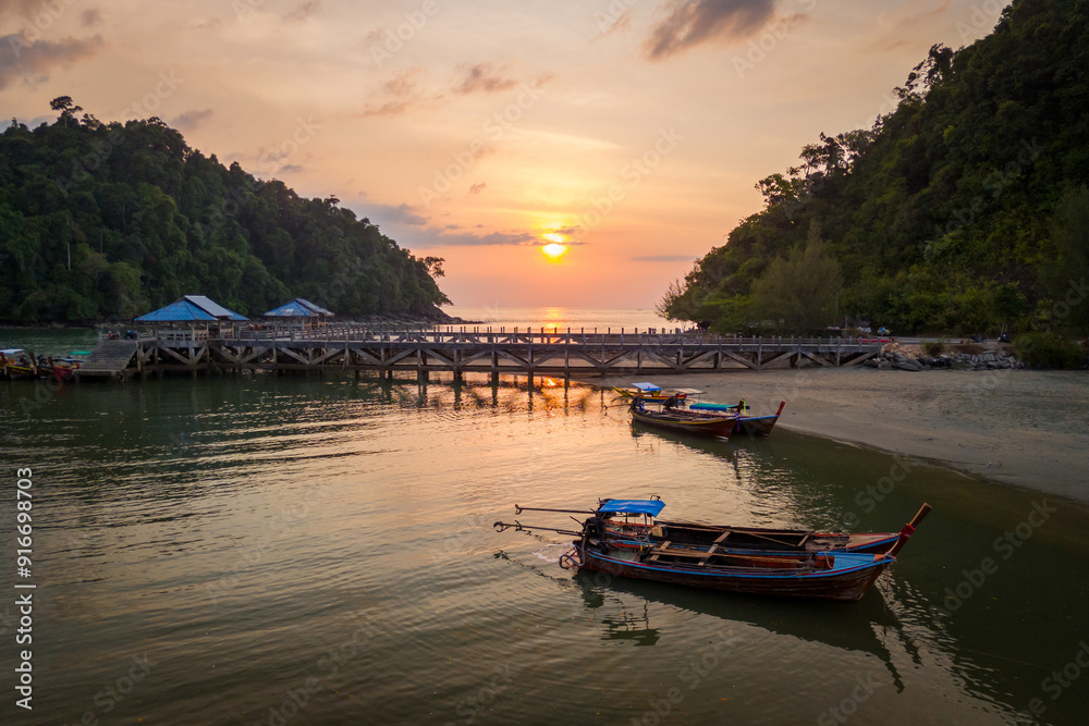 Aerial scenery of the Bang Ben beach with longtail boats in the morning Aerial scenery of the Bang Ben beach with longtail boats in the morning