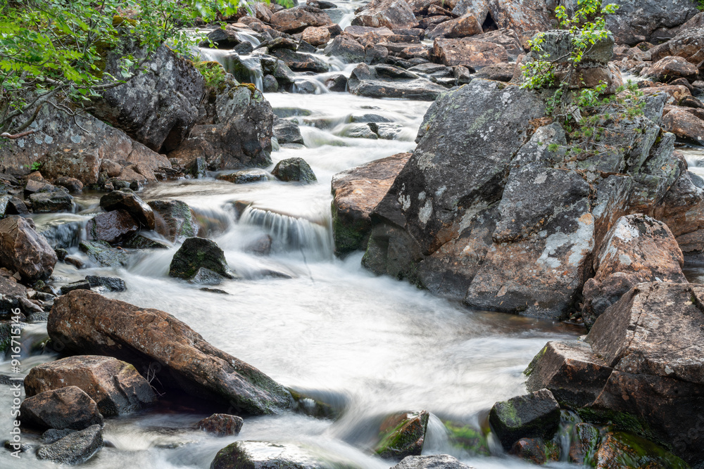 waterfall in the woods of Andalsnes Norway in summer evening fjord waterfall in the woods of Andalsnes Norway in summer evening fjord