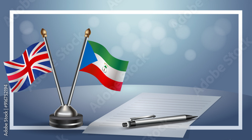 United Kingdom and Equatorial Guinea Small national flag on bokeh background, cooperative relationship