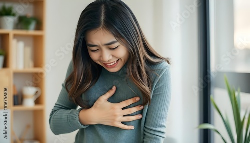 A asian young woman suffering in highly stomach ache and she puts her hand on stomach and crying with pain Free Download A asian young woman suffering in highly stomach ache and she puts her hand on stomach and crying with pain - GFXLoad