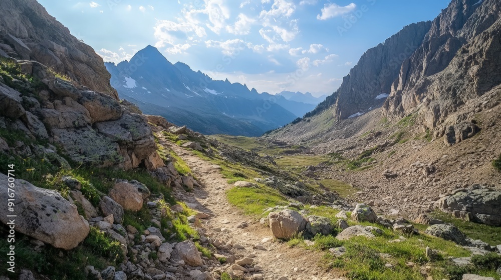 A rugged mountain trail with rocky terrain and stunning views, highlighting the adventurous spirit and natural beauty of hiking through challenging landscapes. A rugged mountain trail with rocky terrain and stunning views, highlighting the adventurous spirit and natural beauty of hiking through challenging landscapes.