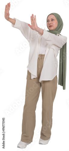 Showing two hands stop gesture, full length side view young caucasian muslim woman wear hijab showing two hands stop gesture. Angry serious young woman refuse resist against something. Copy space.