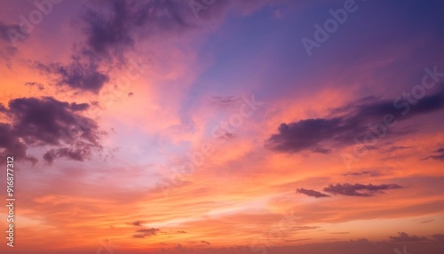 a colorful sunset sky background with gradients of orange pink and purple the textured clouds and soft lighting create a serene and picturesque scene