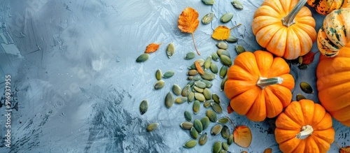 Studio photo of healthy pumpkin seeds and pumpkins with copy space image.