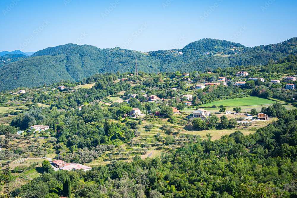 Idyllic hilly landscape of northern Tuscany as viewed from the medieval town of Fosdinovo, Italy Idyllic hilly landscape of northern Tuscany as viewed from the medieval town of Fosdinovo, Italy