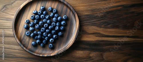 blueberries on a wooden pla...