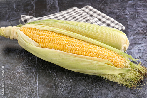 Ripe sweet yellow corn cob photo