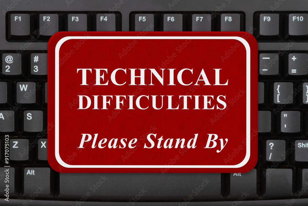 Technical Difficulties sign on keyboard