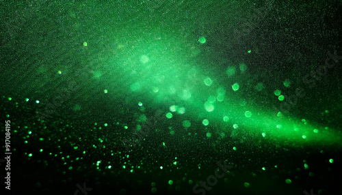 Abstract Green Particles on Textured Black Surface. Ethereal Light Spots and Bokeh Effect in Dark Atmosphere