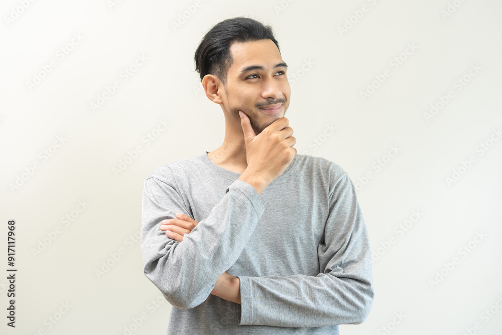 Portrait of positive confident thoughtful, happy asian young man, male standing pose looking away in casual. Smart guy thinking creative, thinks about future, isolated on gray background, copy space. Portrait of positive confident thoughtful, happy asian young man, male standing pose looking away in casual. Smart guy thinking creative, thinks about future, isolated on gray background, copy space.