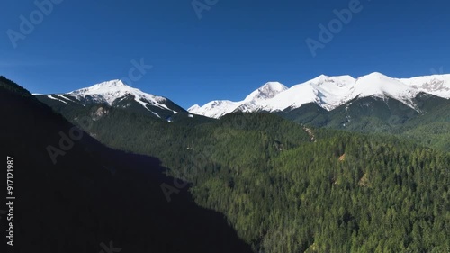 Wallpaper Mural Aerial video of the Pirin Mountains covered in snow under clear blue sky recorded in early Spring Torontodigital.ca