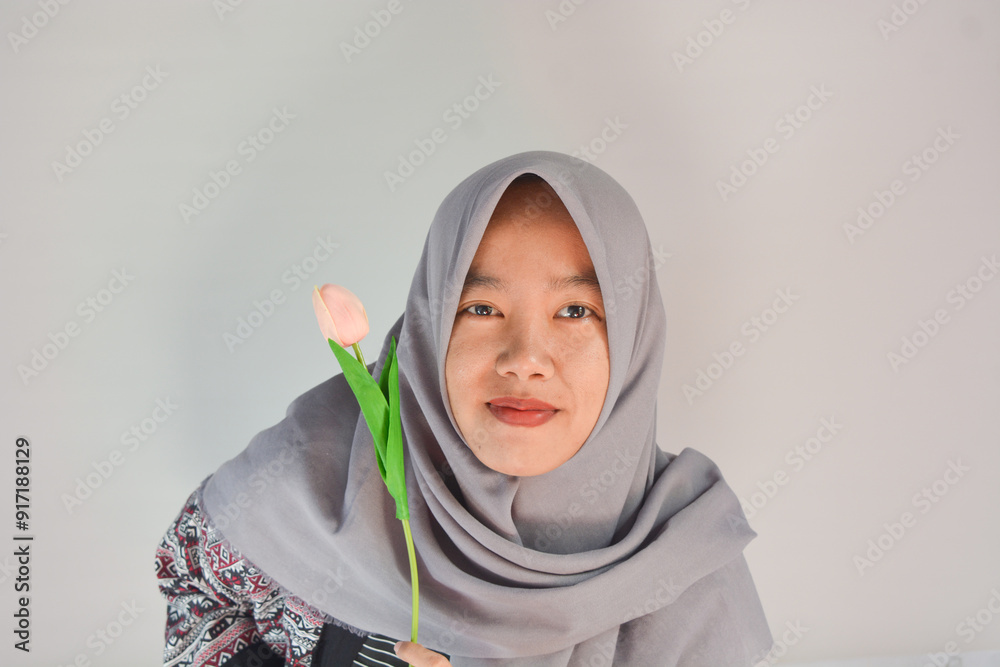 Spring flowers and free happiness concept - unrecognizable out of focus asian woman taking and showing a bunch of colorful fresh flowers in front of the camera Spring flowers and free happiness concept - unrecognizable out of focus asian woman taking and showing a bunch of colorful fresh flowers in front of the camera