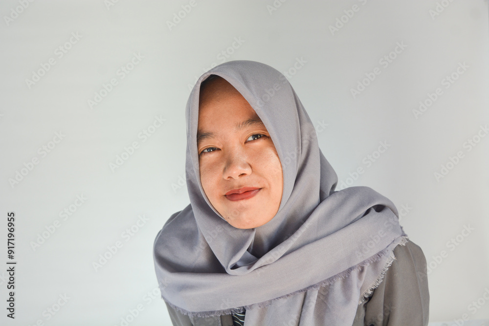 Portrait of a confident Asian woman facing the camera on an isolated background Portrait of a confident Asian woman facing the camera on an isolated background
