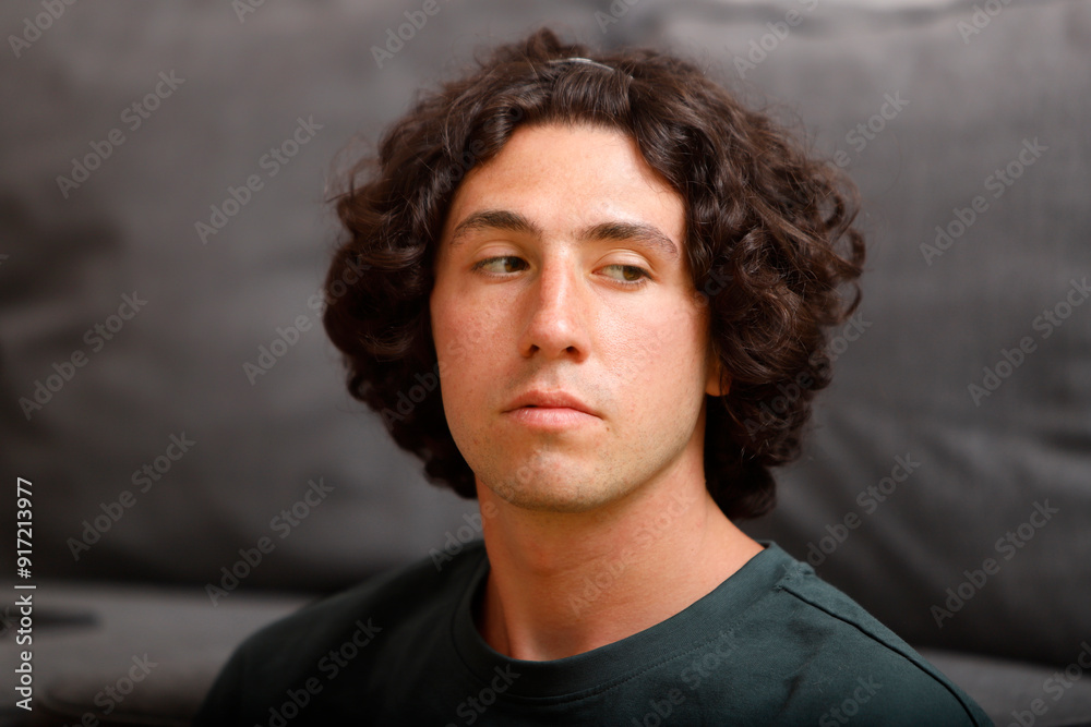 caucasian guy with long wavy hair looking out of the corner of his eye caucasian guy with long wavy hair looking out of the corner of his eye