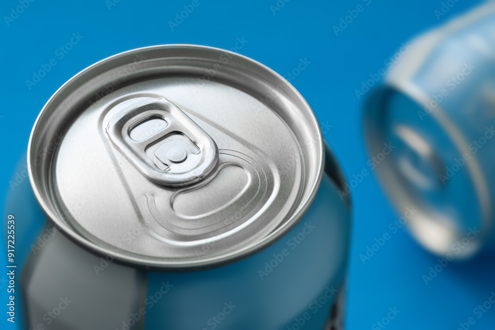 Aluminum beer can on blue background close-up. Selective focus Aluminum beer can on blue background close-up. Selective focus