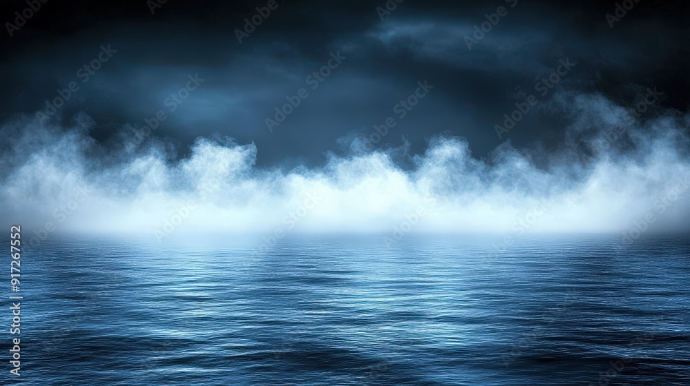 Fototapeta premium Fog rises over calm waters during twilight hours