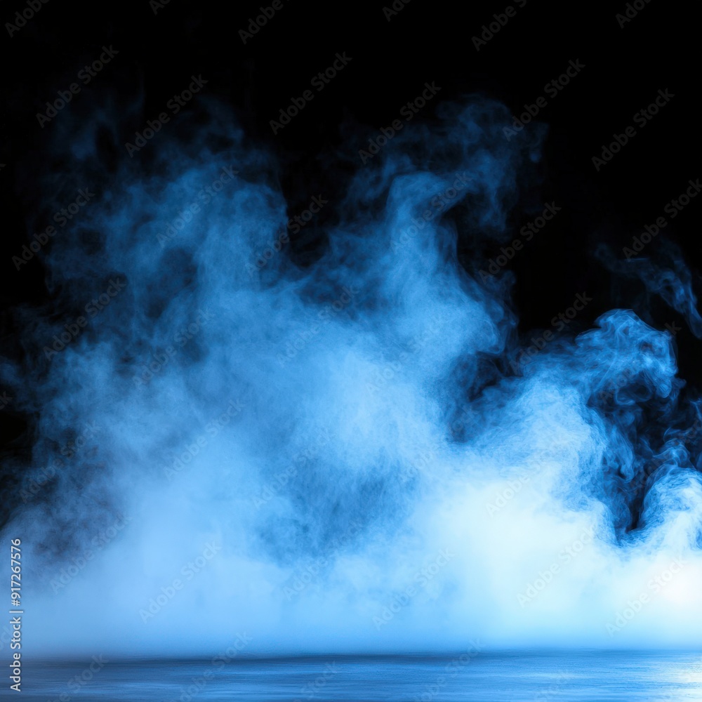 Fototapeta premium Gentle blue mist rises slowly over a calm surface in dim light