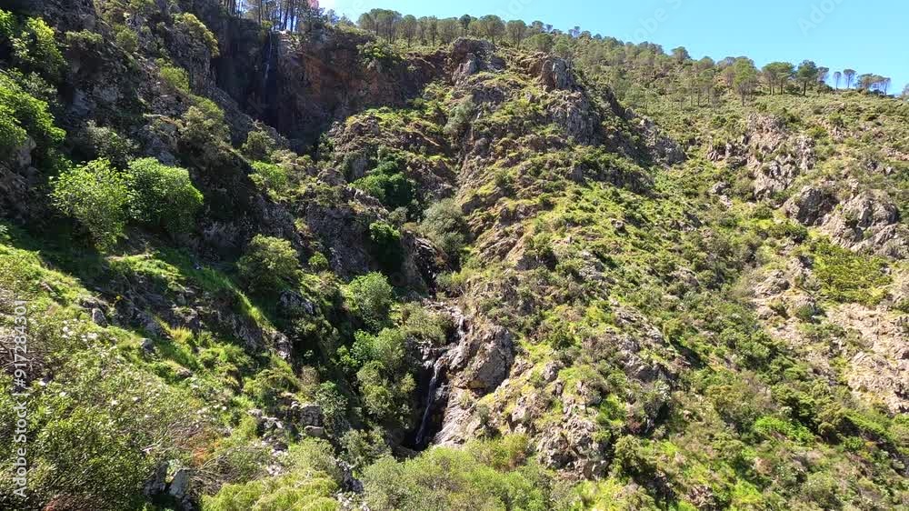 Hiking trail to waterfalls over river Caballos, Sierra de la Nieves National Park in Tolox, Malaga, Spain