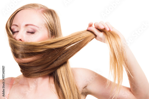 Girl covering her mouth with long hair