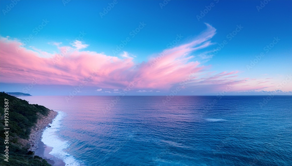 Fototapeta premium A pink and blue sky over the ocean