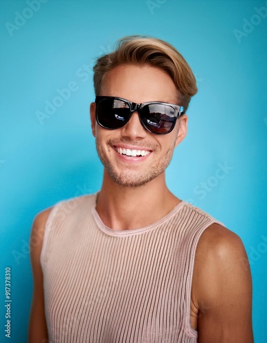 A handsome man wearing sunglasses in a isolated background