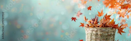 Autumn Leaves Falling From Basket Against Soft Blue Background