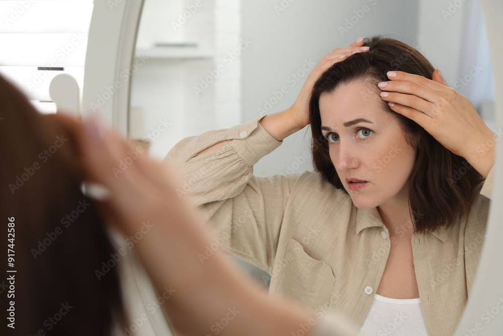 Fototapeta premium Woman with hair loss problem at home