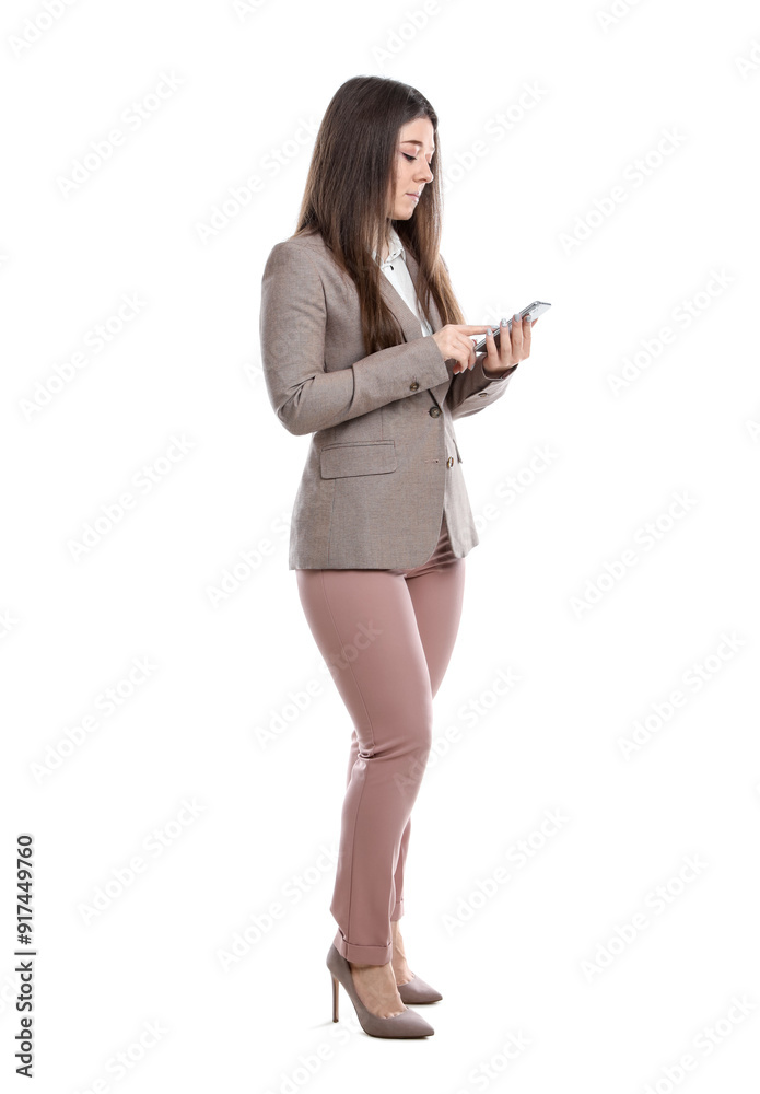 Young woman in business attire using mobile phone on white background Young woman in business attire using mobile phone on white background