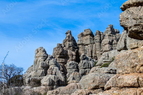 Hiking in the Torcal de Antequerra National Park, limestone rock formations and known for unusual karst landforms in Andalusia, Malaga, Spain. photo