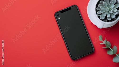 Red Smartphone Against Gradient Background in Soft Lighting