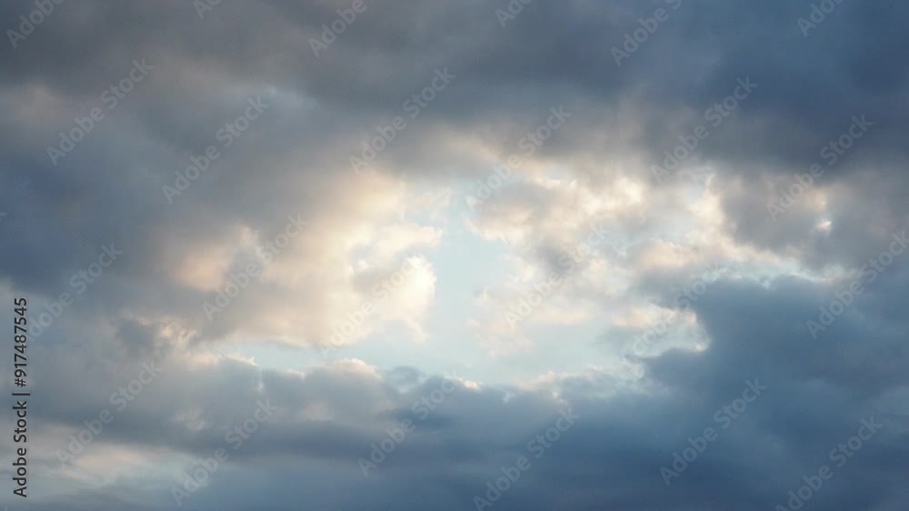 Clouds are floating across the sky, solar intervals. The weather is getting worse. Delicate blue, yellow and pink colors of the sunset. Real time. Slow cloud movements Clouds are floating across the sky, solar intervals. The weather is getting worse. Delicate blue, yellow and pink colors of the sunset. Real time. Slow cloud movements