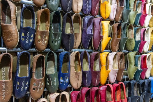 Traditional turkish leather shoes named yemeni. Colorful handmade leather slipper shoes displayed on the street market in Turkey.