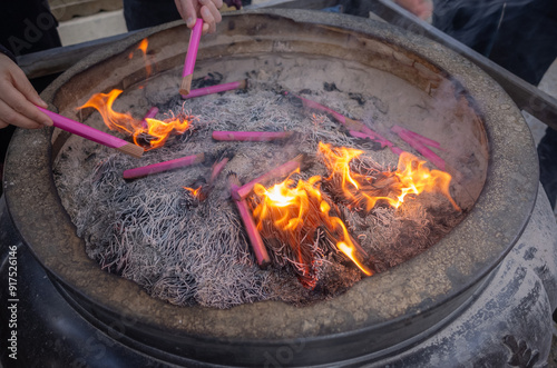 religious incense sticks burning on the ash in taishakuten temple in shibamata