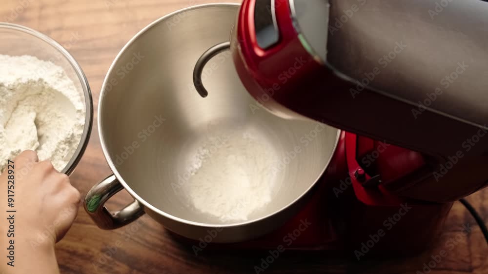 Add all-purpose flour by tablespoons to a stainless steel bowl, red stand mixer