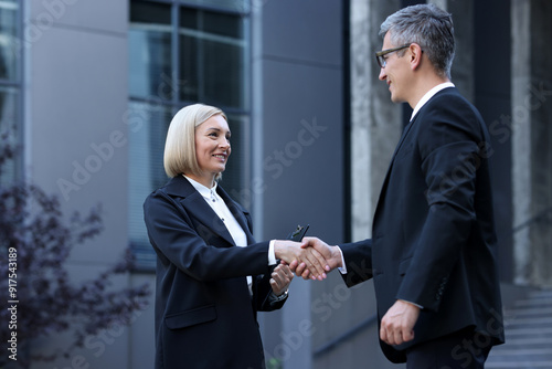 International relations. Diplomats shaking hands during meeting outdoors photo