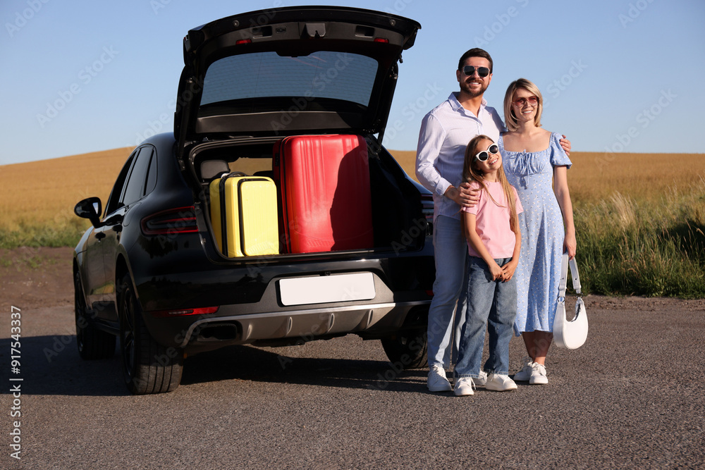 Happy family near car with suitcases outdoors Happy family near car with suitcases outdoors