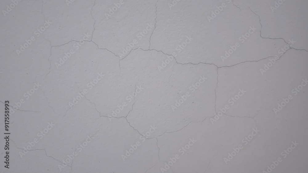 Obraz premium Small cracks on the white wall
