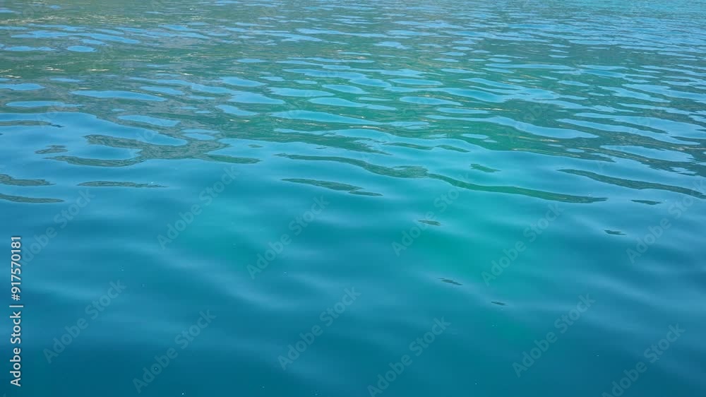 Boat trip moving on azure Adriatic Mediterranean Sea. Blue water surface. Travel, boat trips, summer holidays, tourism Montenegro, Budva region. Calm bottomless sea. Yacht sport. Travel beach holidays Boat trip moving on azure Adriatic Mediterranean Sea. Blue water surface. Travel, boat trips, summer holidays, tourism Montenegro, Budva region. Calm bottomless sea. Yacht sport. Travel beach holidays