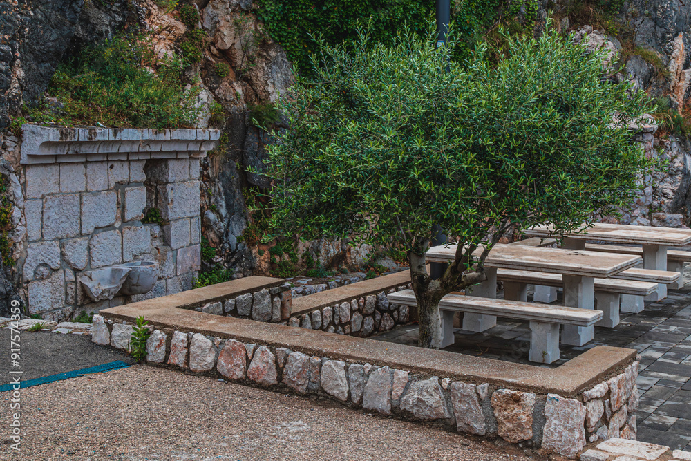 Brick barbecue, water and a place with picnic tables Vrbnik Croatia 27.06.2024 Brick barbecue, water and a place with picnic tables Vrbnik Croatia 27.06.2024