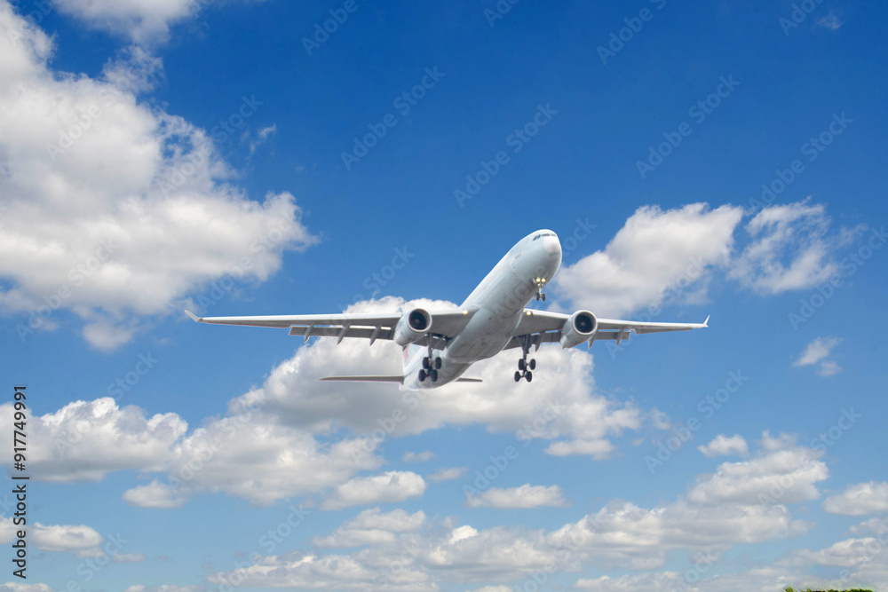White passenger airplane flying in the sky amazing clouds in the background White passenger airplane flying in the sky amazing clouds in the background
